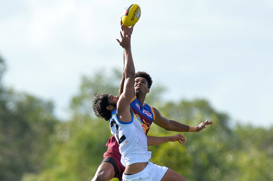 AFL 2016 NAB Challenge - Brisbane Lions v Gold Coast BURPENGARY, AUSTRALIA - FEBRUARY 21: Archie Smith of the Lions and Tom Nicholls of the Suns compete for the ball during the 2016 NAB Challenge match between the Brisbane Lions and the Gold Coast Suns at Moreton Bay Central Sports Complex, Burpengary on February 21, 2016. (Photo by Bradley Kanaris/AFL Media)